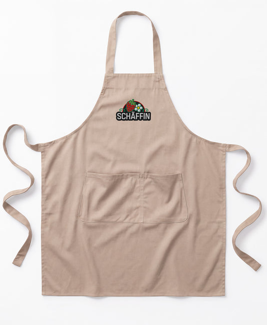 Produktbild der naturfarbenen SCHÄFFIN Schürze mit Erdbeer Stichmotiv einer und Schriftzug.