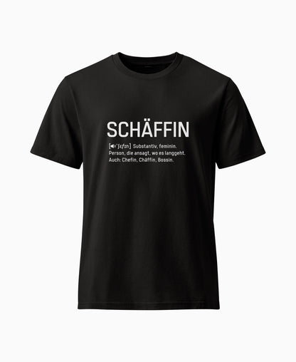 Schwarzes  T-Shirt mit weissem Frontaufdruck im Wörterbuch-Stil: SCHÄFFIN – Substantiv, feminin. Person, die ansagt, wo es langgeht. Auch: Chefin, Chäffin, Bossin.
