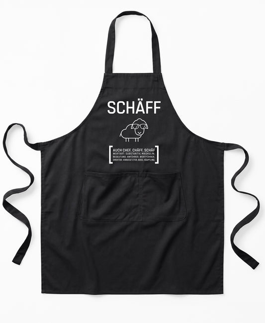 Schwarze Premium SCHÄFF – Chef Schürze Classic  aus Bio-Baumwolle mit witzigem Wörterbuch-Design und zwei großen Vordertaschen.