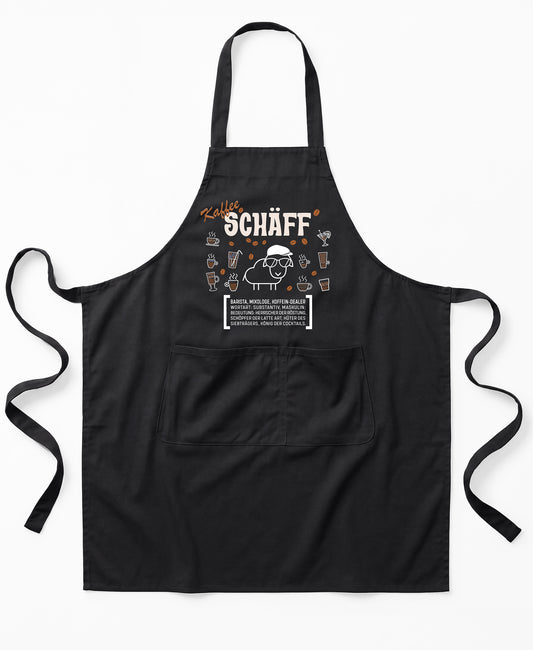 Schwarze Premium SCHÄFF – Kaffee Chef Schürze aus Bio-Baumwolle mit witzigem Wörterbuch-Design und zwei großen Vordertaschen.