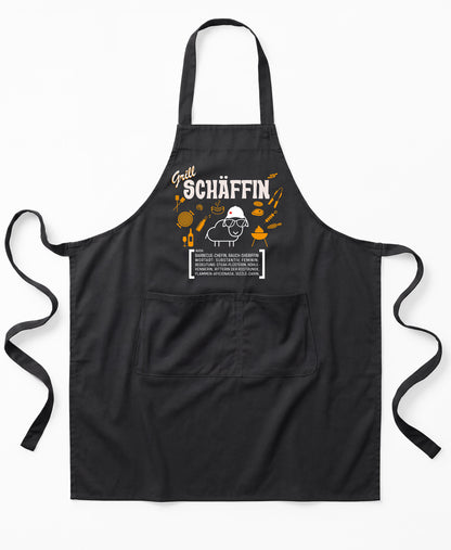 Schwarze Premium SCHÄFFIN – Grill Chefin Schürze aus Bio-Baumwolle mit witzigem Wörterbuch-Design und zwei großen Vordertaschen.