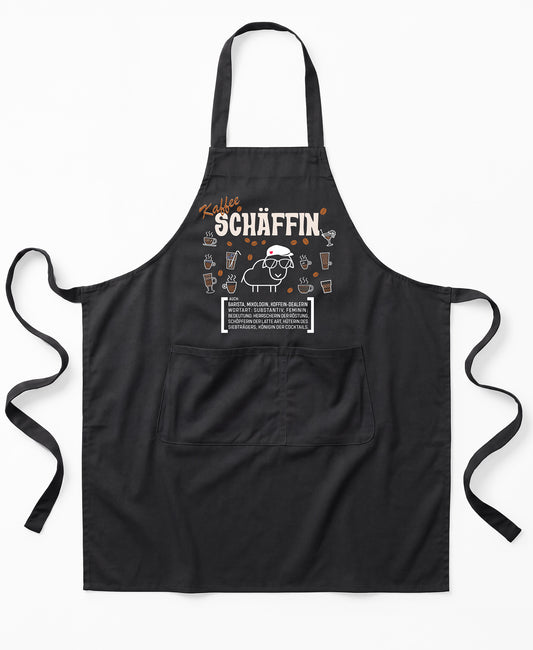 Schwarze Premium SCHÄFFIN – Kaffee Chefin Schürze aus Bio-Baumwolle mit witzigem Wörterbuch-Design und zwei großen Vordertaschen.