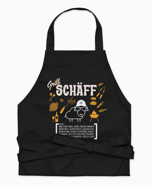 Schwarze Premium Grill SCHÄFF Kochschürze aus Bio-Baumwolle mit witzigem Wörterbuch-Design und zwei großen Vordertaschen auf weißem Hintergrund.