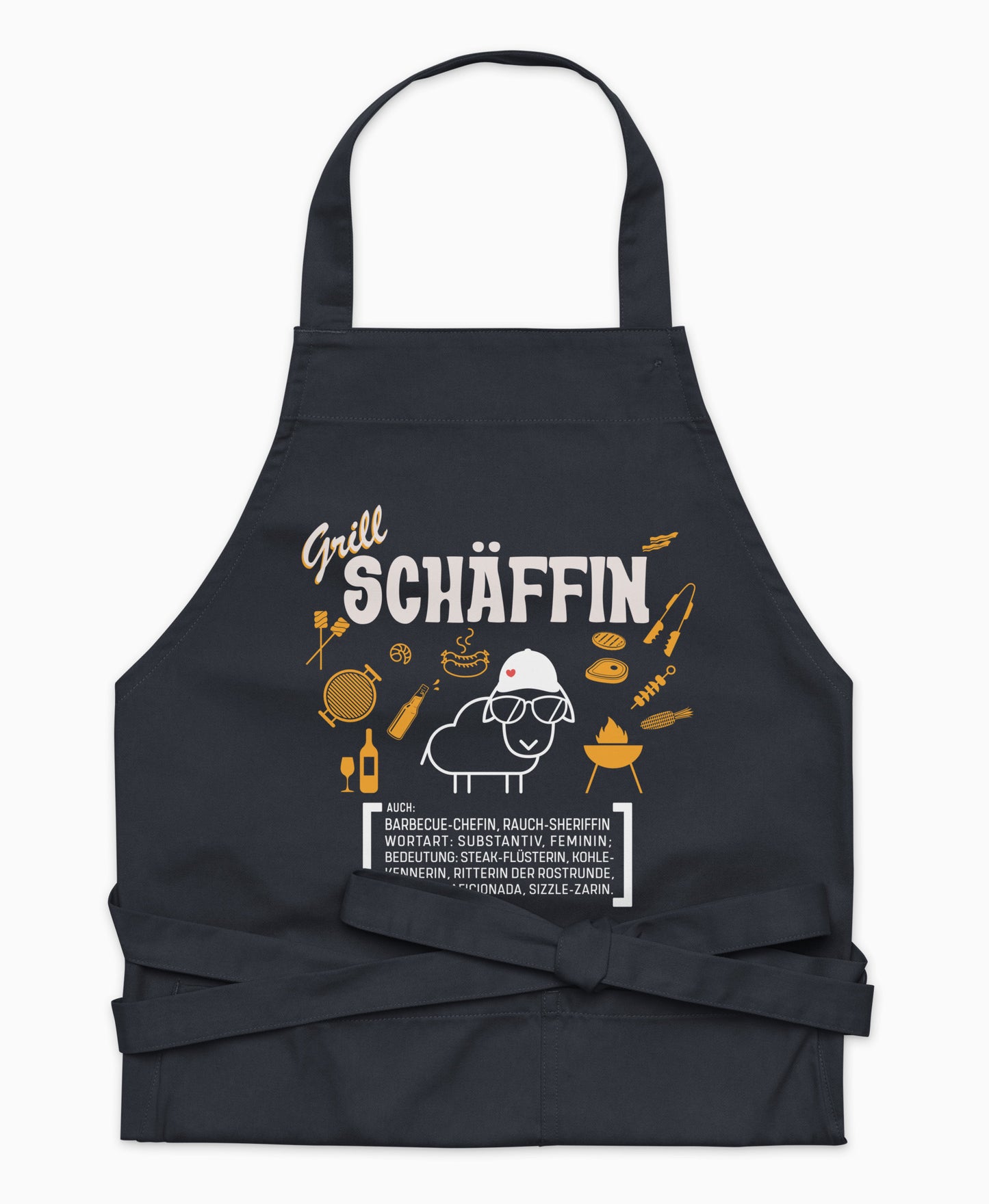 Dunkelblaue Premium Grill SCHÄFFIN Kochschürze aus Bio-Baumwolle mit witzigem Wörterbuch-Design und zwei großen Vordertaschen auf weißem Hintergrund.
