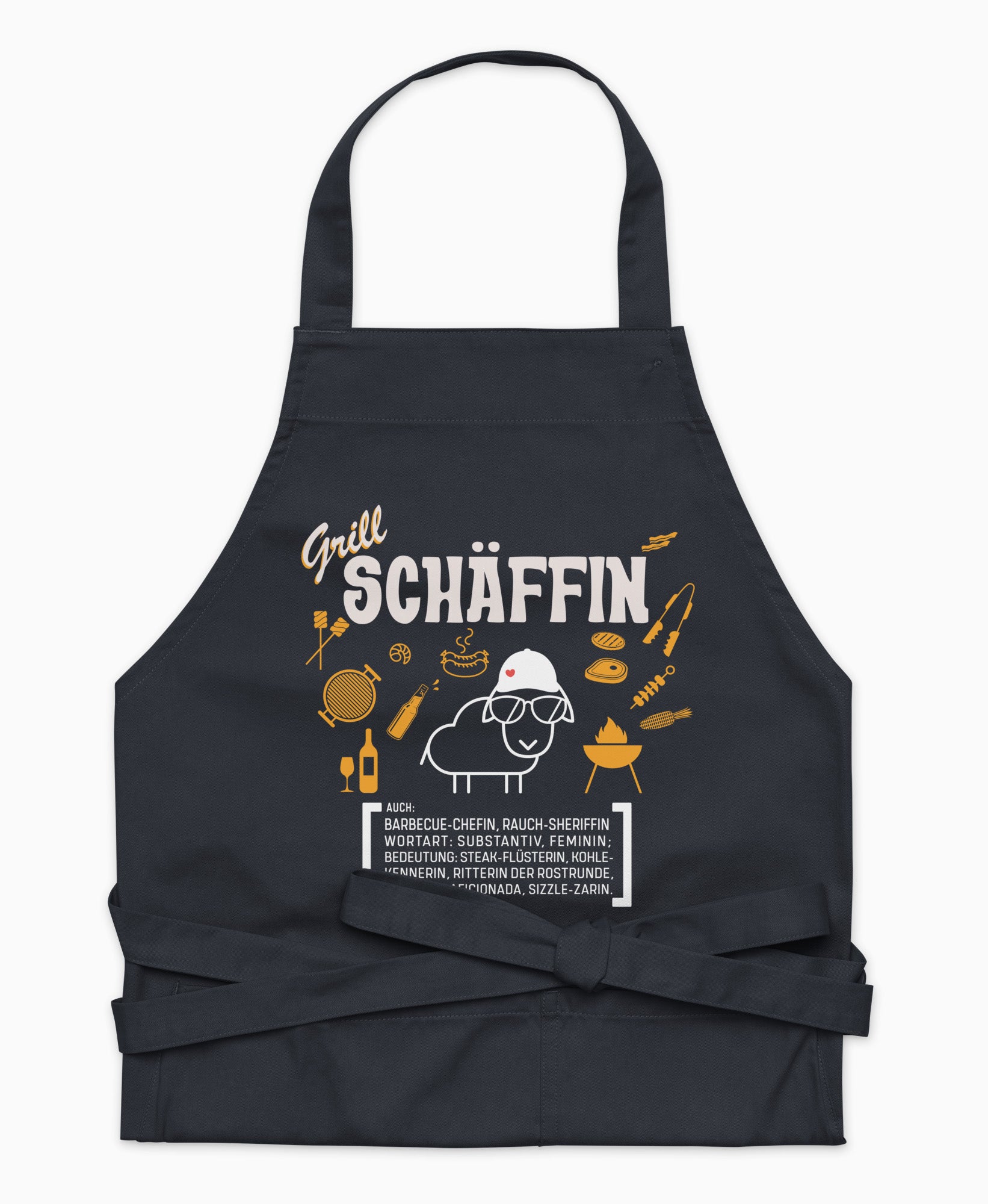 Dunkelblaue Premium Grill SCHÄFFIN Kochschürze aus Bio-Baumwolle mit witzigem Wörterbuch-Design und zwei großen Vordertaschen auf weißem Hintergrund.