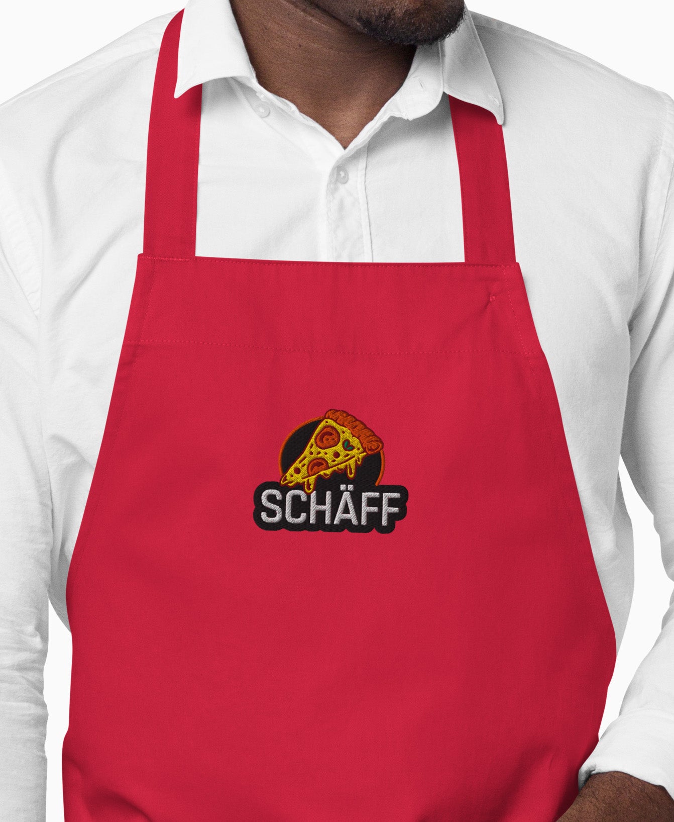 Vorderansicht der signalroten SCHÄFF Pizzabäcker Schürze aus Bio-Baumwolle mit Pizza-Stickmotiv.